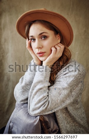 portrait of a girl in a brown hat