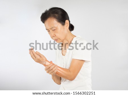 old asian woman feel wrist bones injury	
