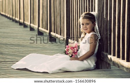 a girl in a wedding dress on the beach Royalty-Free Stock Photo #156630896