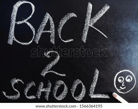 back to school thoughts presented on chalkboard with smile 