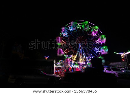 local Ferris wheel Decorated with different colored lights