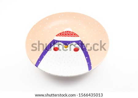 beautiful plate with the image of a penguin on a white background