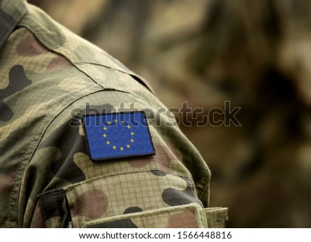 The Flag of Europe on military uniform. Collage. Royalty-Free Stock Photo #1566448816