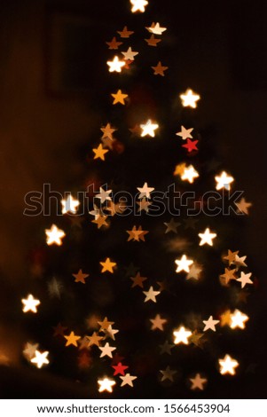 Christmas background with bokeh lights in a tree shape.