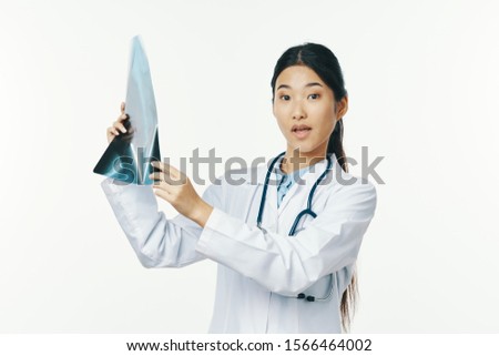 female doctor asian appearance beautiful face and x-ray