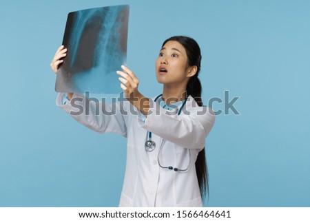 X-ray woman doctor medical gown blue background
