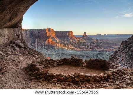 So-called 'False Kiva' class 2 archaeological site in Canyonlands National Park, with a view of Candlestick Tower in the Background