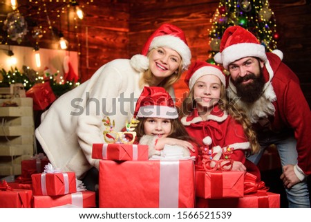 Happy holidays. Spend time with your family. Friendly family winter vacation. Family tradition. Parents and children excited about christmas. Bearded man and mother with cute daughters christmas eve.
