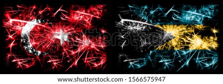 Turkey, Turkish vs Bahamas, Bahamian New Year celebration sparkling fireworks flags concept background. Combination of two abstract states flags.
