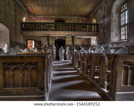 Abandoned church with ghosts installation Royalty-Free Stock Photo #1566589252