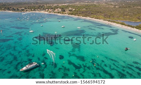 Aerial Drone View of Saint Cyprien Bay with Boats on Green Sea