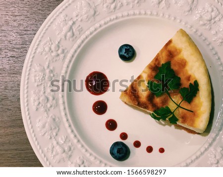 A picture of a cheesecake on a plate.