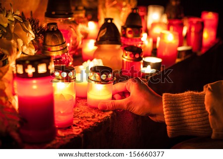 Candles Burning At a Cemetery During All Saints Day. Shallow depth of field. Royalty-Free Stock Photo #156660377
