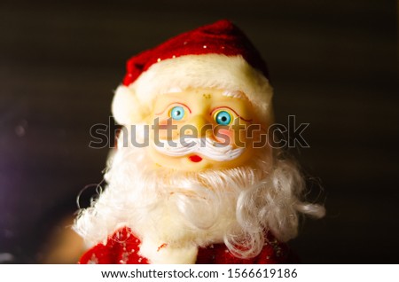 Santa Claus, Santa Claus toy. Beard boots, belt in macro. The suit is New Year's. Figure, figurine