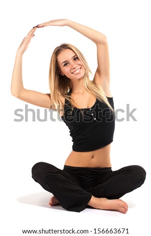 Smiling beautiful woman doing exercise isolated on white background