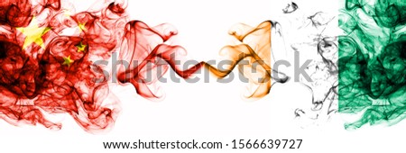 China, Chinese vs Ivory Coast smoky mystic states flags placed side by side. Concept and idea thick colored silky abstract smoke flags