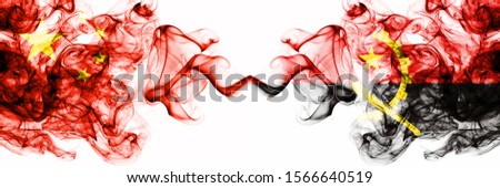 China, Chinese vs Angola, Angolan smoky mystic states flags placed side by side. Concept and idea thick colored silky abstract smoke flags
