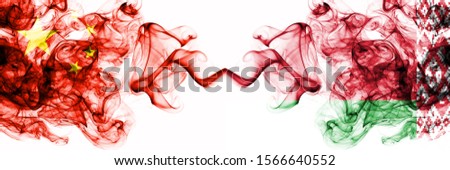 China, Chinese vs Belarus, Belarusian smoky mystic states flags placed side by side. Concept and idea thick colored silky abstract smoke flags