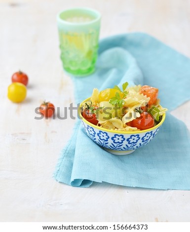pasta with tomato and pumpkin in a bowl
