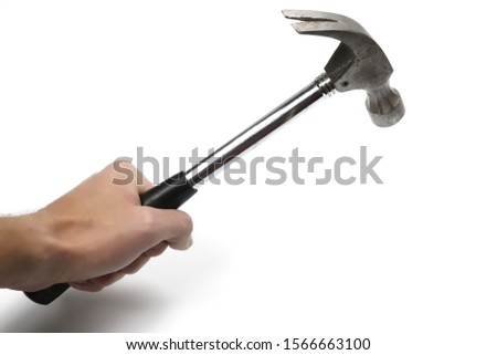 Hand with hammer on white background. Royalty-Free Stock Photo #1566663100