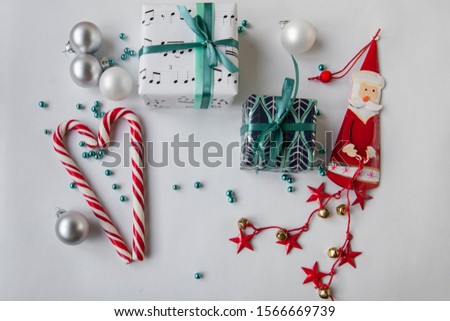 Christmas decorations wrapped presents candy canes and santa claus background
