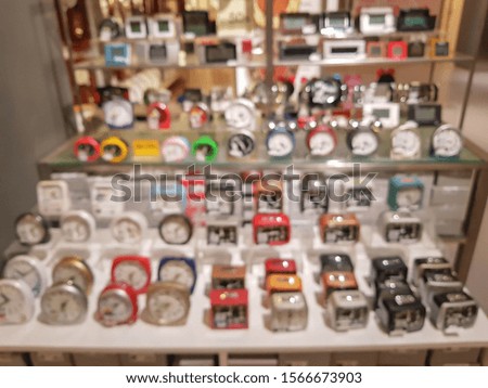 The blurred image of Table alarm clock and table digital clock and There are many sizes and many styles and colorful.