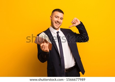 young handsome businessman  against flat background money concept