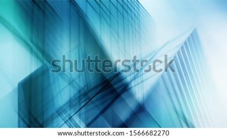 Abstract business modern city urban futuristic architecture background, motion blur, reflection in glass of high rise skyscraper facade, toned blue picture with bokeh. Real estate concept