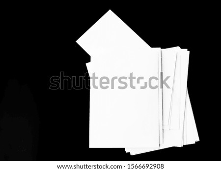White paper isolated on black background, Poster mock-ups paper Blank portrait A4. brochure. use for magazine banners products business cards to showcase your