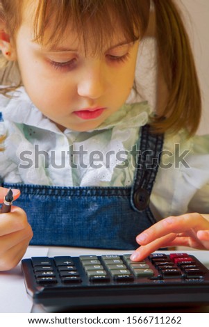 Humorous photo of young business girl calculate profit US Dollar banknotes with calculator. 