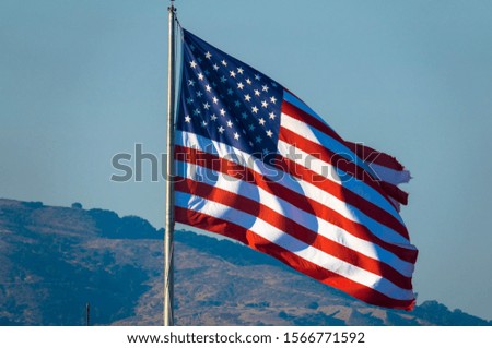 American flag with  Mountain in the background