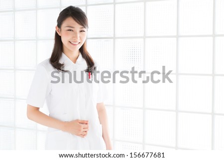 Young attractive asian nurse of the smile