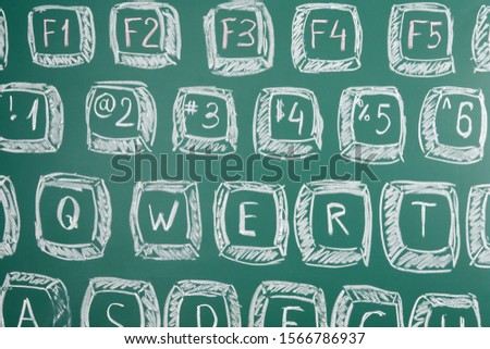 Photo of a computer keyboard drawn on a school blackboard