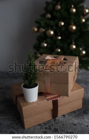 pastries in a box on the background of a Christmas tree