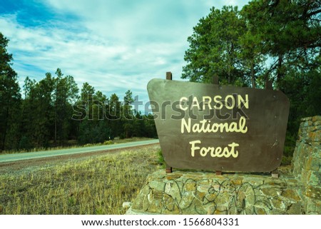 Welcome sign to the Carson National Forest along highway 68 near Taos, New Mexico.