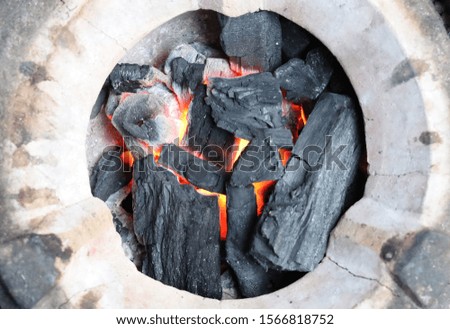 Burning charcoal on the stove.