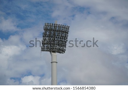 picture showing an isolated floodlight of a stadium during daytime