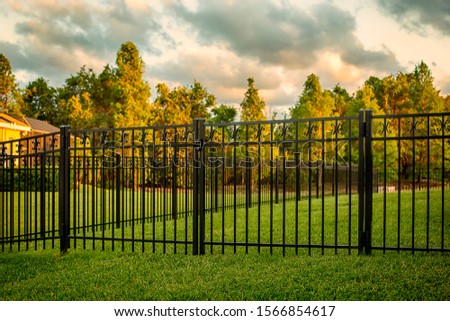 Black Aluminum Fence with double gates
 Royalty-Free Stock Photo #1566854617