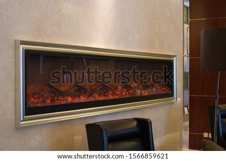 Tacky fake fire place with a picture frame