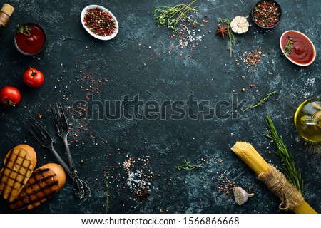 Stone cooking banner. Kitchen board with vegetables and spices. Top view. Free copy space.