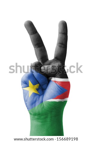 Hand making the V sign, South Sudan flag painted as symbol of victory, win, success - isolated on white background