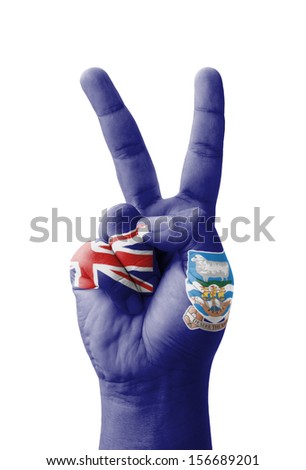 Hand making the V sign, Falkland Islands flag painted as symbol of victory, win, success - isolated on white background