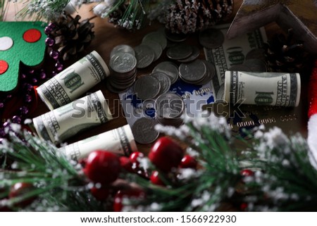 Dollars cutlets with coin lie on table chistmas background closeup. Big xmas sale rich concept