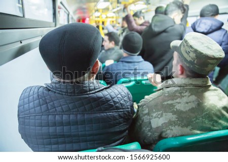 People sitting on a comfortable bus in Selective focus and blurred background. s the main mass transit passengers in the bus. People in old public bus, view from inside the bus .