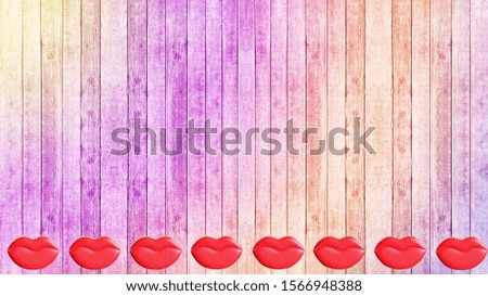 Valentine's day. Cookies in the shape of lips and heart on a wooden colorful background. Plenty of room for text