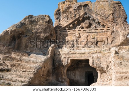 Historical ancient Frig (Phrygia, Gordion)  Valley. Lion temple, hall tomb, structures,  carved into  rocks. Frig Valley is popular tourist attraction in the Yazilikaya, Afyon. / Turkey. Royalty-Free Stock Photo #1567006303