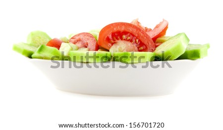 dish from tomatoes and cucumbers isolated on a white background. picture from series.