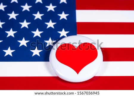 A heart symbol pictured over the flag of the United States of America.