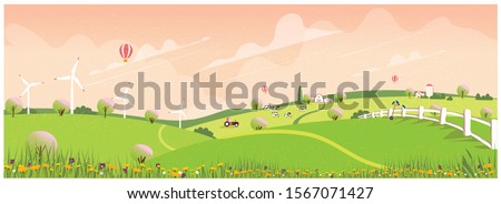 Wild panoramic rural countryside in spring.Green hill with apple allay with canola and spring flower.Concept of farm agriculture in spring. Royalty-Free Stock Photo #1567071427