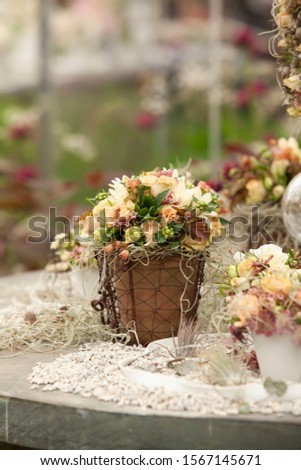 flowers in jar show on the stone table